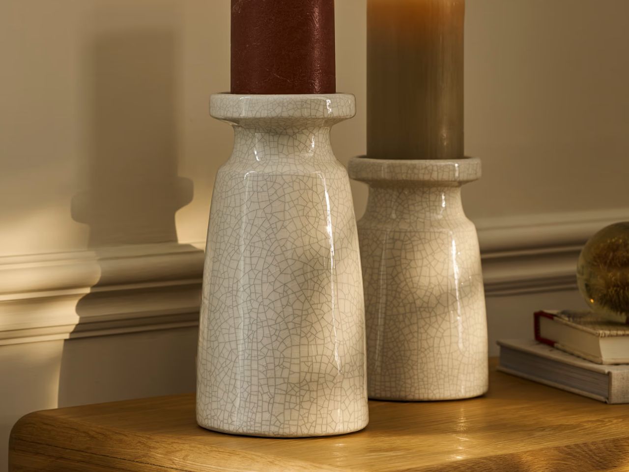 large candle holder on table by medium candle holder