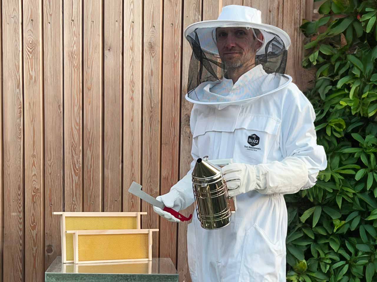 The buzz box beehive with a beekeeper