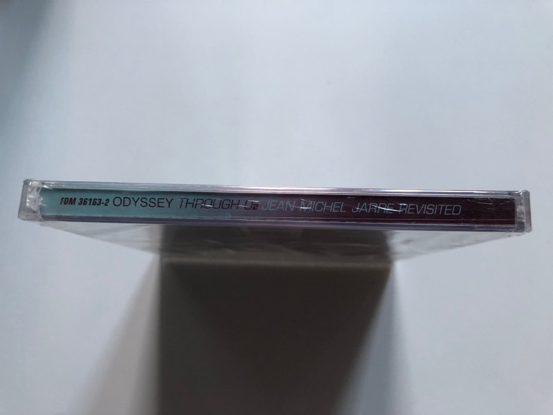 Jean Michel Jarre – Odyssey Through O₂ / Revisited By: Tetsuya ''TK'' Komuro, Apollo Four Forty, DJ Cam, Loop Guru, Resistance D, Hani, Boodjie & Veronika, Sunday Club, Takkyu Ishino / Disques Dreyfus Audio CD 1998 / FDM 36163-2