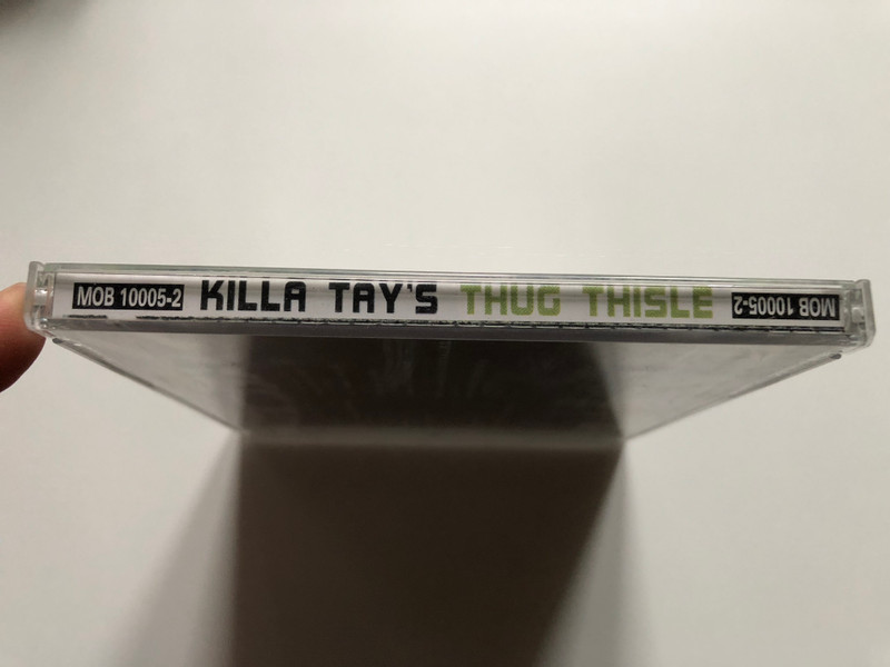 Greedy Green Entertainment Presents - Killa Tay – Thug Thisle / Featuring: 2 Pac's Outlaws; Brotha Lynch; C-BO; Bad Azz; Spice 1; King T; Guce; 3XKrazy; Killa Tay & Family / Mo Beatz Records! Audio CD / MOB 10005-2