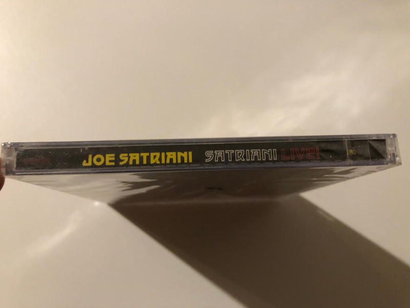 Joe Satriani – Satriani Live! / Double-CD Set, Recorded Live At The Grove, May 2006 / Includes Live Favorites ''Satch Boogie'', ''Flying In A Blue Dream'' And ''Super Colossal'' / Also Available On DVD / Epic 2x Audio CD 2006 / 88697017252