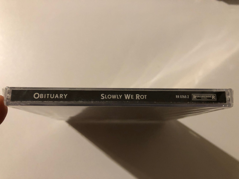 Obituary – Slowly We Rot / The Obituary Remasters. Digitally remastered gold disc with neew expanded package - sounds better, rocks harder, looks killer! / Roadrunner Records Audio CD 1997 / RR 8768-2