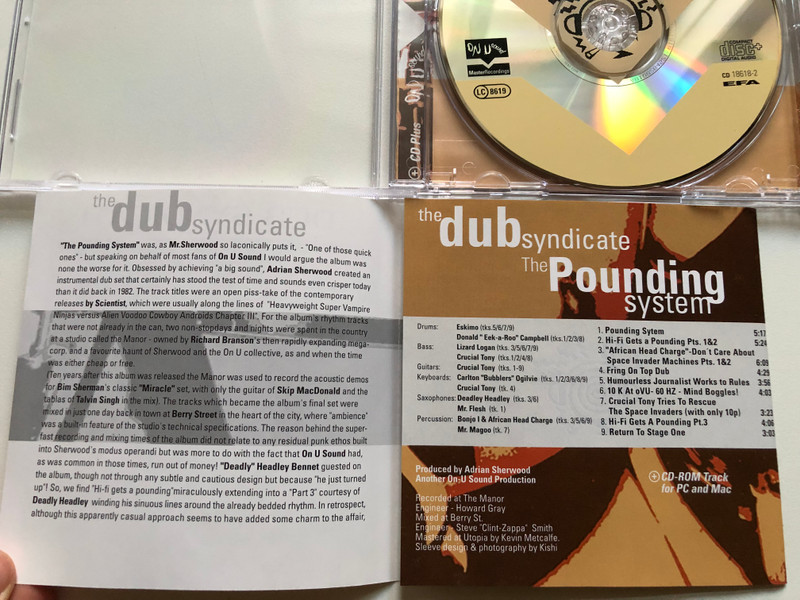 The Dub Syndicate – The Pounding System (Ambience In Dub) / Featuring the legendary 'Crucial' Tony, 'Izard, Eskimo, Bonjo I, Deadly Headley, and introducing ''Eek-a-Roo'' & ''Bubblers'' / On-U Sound Audio CD 1998 / ON-U CD 0018