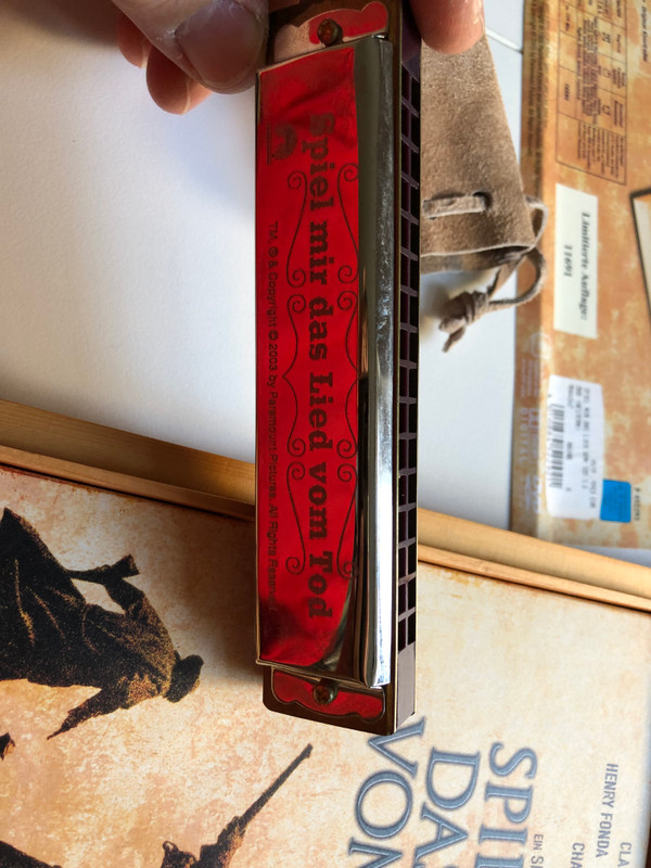 The box is made of wood and besides a 2 disc edition of the movie and the CD it also contains a harmonica