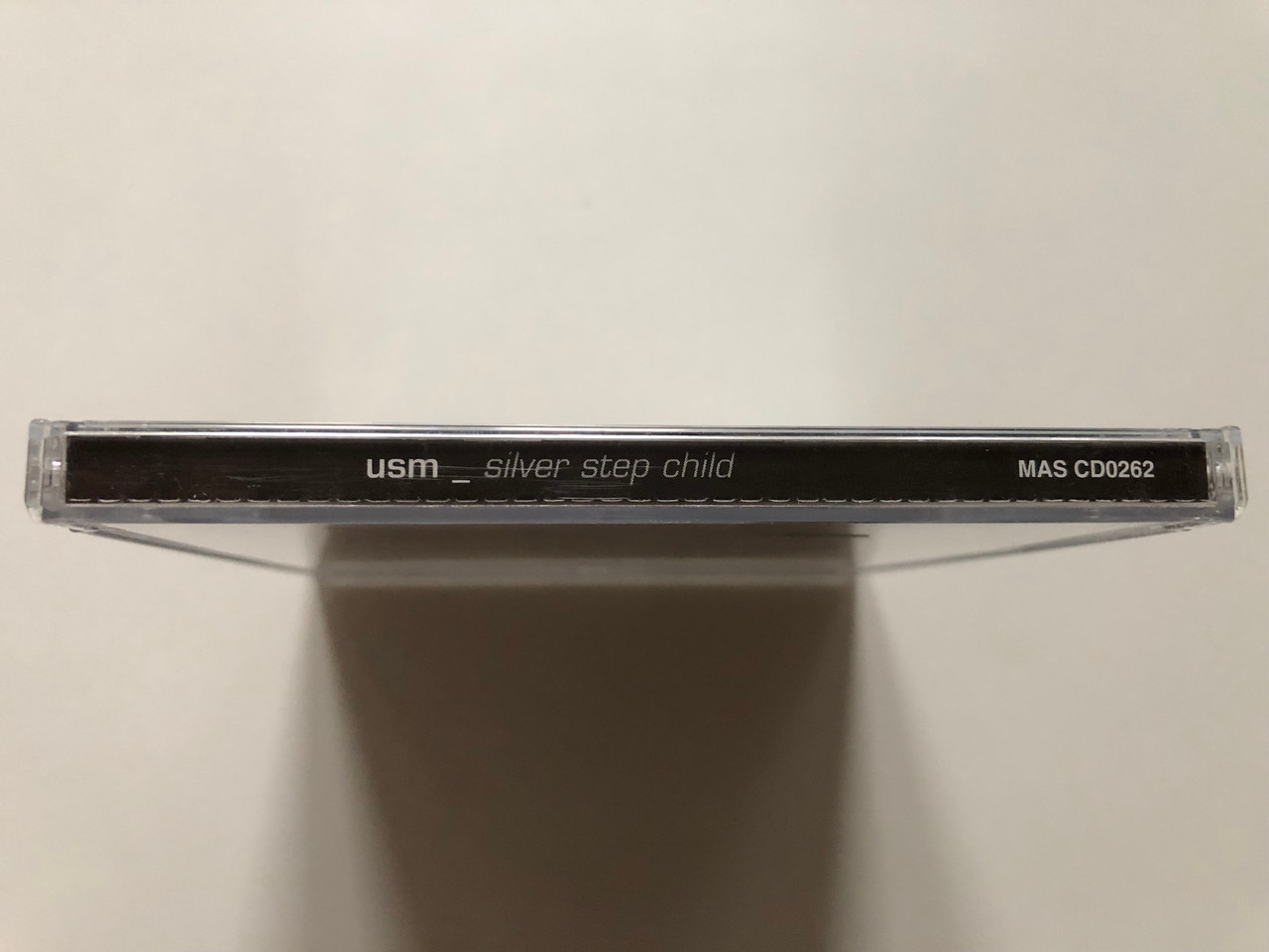 https://cdn11.bigcommerce.com/s-62bdpkt7pb/products/0/images/314992/USM_United_States_Of_Mind_Silver_Step_Child_Massacre_Records_Audio_CD_2000_MAS_CD0262_3__22123.1701715535.1280.1280.JPG?c=2