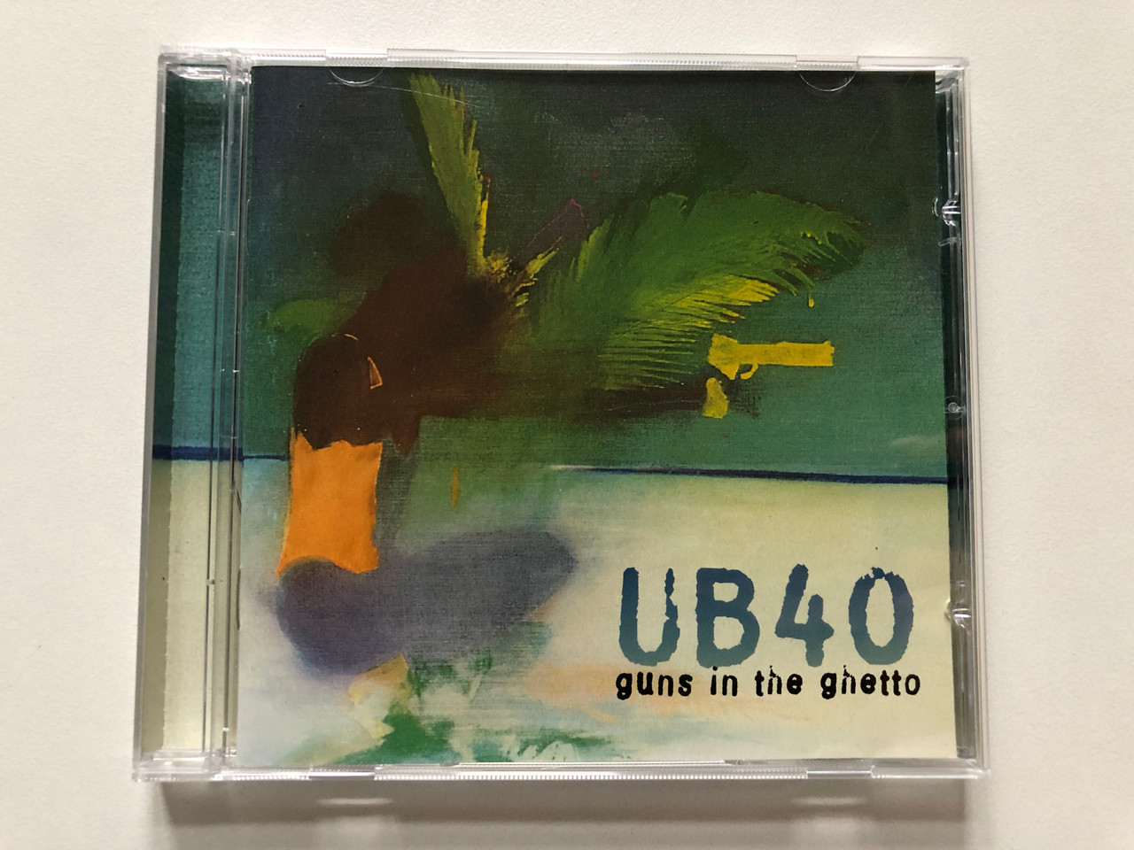 https://cdn11.bigcommerce.com/s-62bdpkt7pb/products/0/images/314993/UB40_Guns_In_The_Ghetto_Virgin_Audio_CD_1997_724384440220_1__81101.1701791464.1280.1280.JPG?c=2