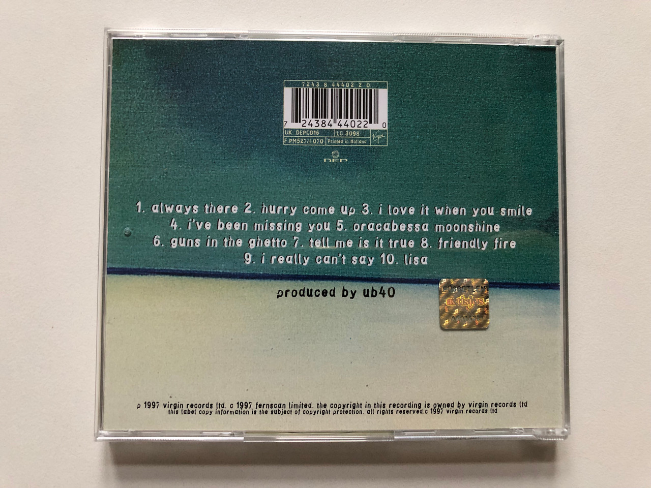 https://cdn11.bigcommerce.com/s-62bdpkt7pb/products/0/images/314994/UB40_Guns_In_The_Ghetto_Virgin_Audio_CD_1997_724384440220_2__98541.1701791475.1280.1280.JPG?c=2