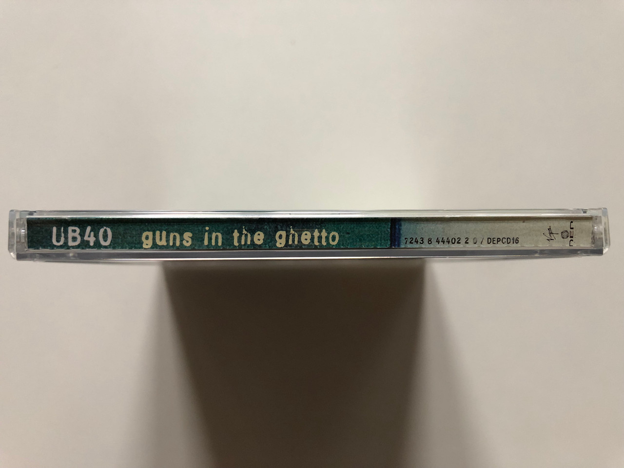 https://cdn11.bigcommerce.com/s-62bdpkt7pb/products/0/images/314995/UB40_Guns_In_The_Ghetto_Virgin_Audio_CD_1997_724384440220_3__38636.1701791482.1280.1280.JPG?c=2