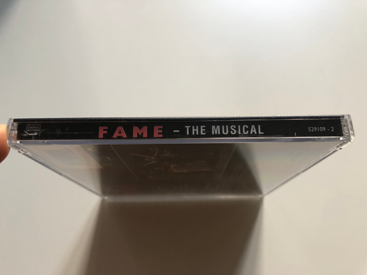 https://cdn11.bigcommerce.com/s-62bdpkt7pb/products/0/images/316136/Original_London_Cast_Fame_The_Musical_Really_Useful_Records_Audio_CD_1995_529109-2_3__71489.1702465430.1280.1280.JPG?c=2