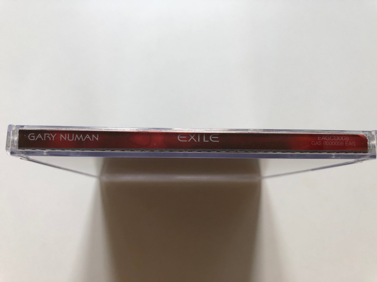 https://cdn11.bigcommerce.com/s-62bdpkt7pb/products/0/images/316349/Gary_Numan_Exile_Eagle_Records_Audio_CD_1997_EAGCD008_3__37264.1702488036.1280.1280.JPG?c=2