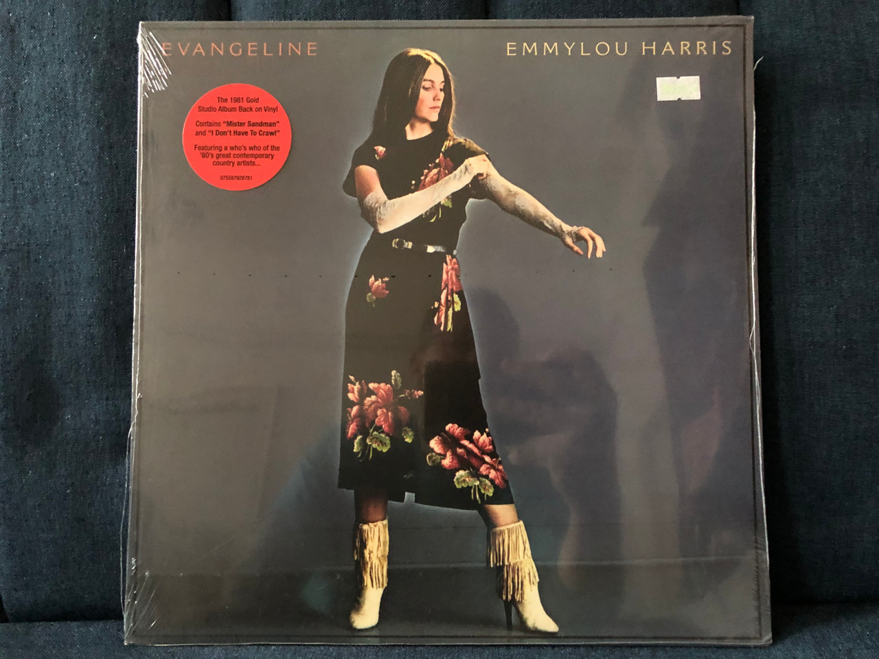 https://cdn11.bigcommerce.com/s-62bdpkt7pb/products/0/images/316468/Emmylou_Harris_Evangeline_The_1981_Gold_Studio_Album_Back_On_Vinyl_Contains_Mister_Sandman_and_I_Dont_Have_To_Crawl_Featuring_a_whos_who_of_the_80s_great_contemporary_country_1__22160.1702625809.1280.1280.JPG?c=2