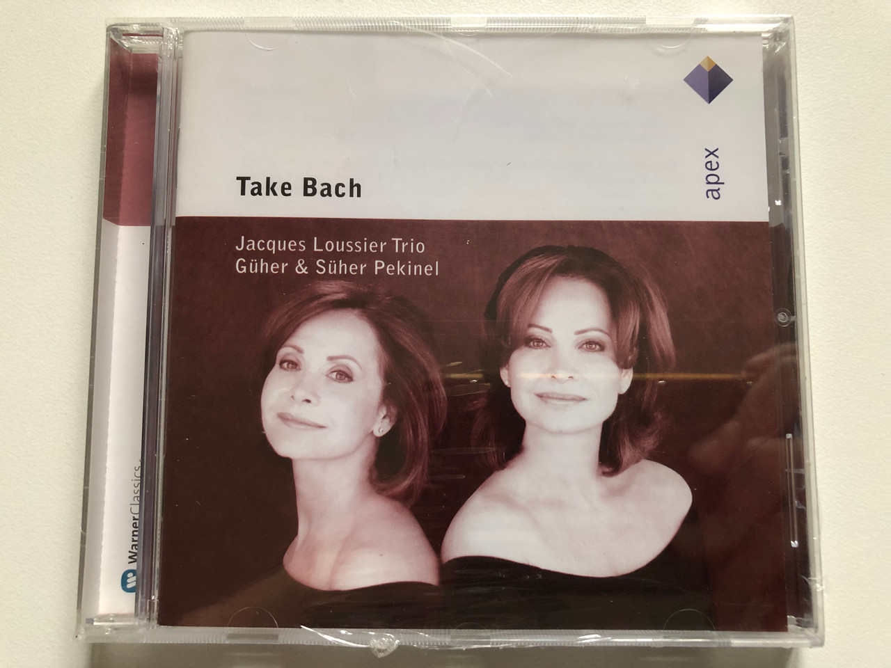https://cdn11.bigcommerce.com/s-62bdpkt7pb/products/0/images/316644/Take_Bach_-_Jacques_Loussier_Trio_Gher_Sher_Pekinel_Apex_Audio_CD_2005_2564_62116-2_1__02196.1702895167.1280.1280.JPG?c=2