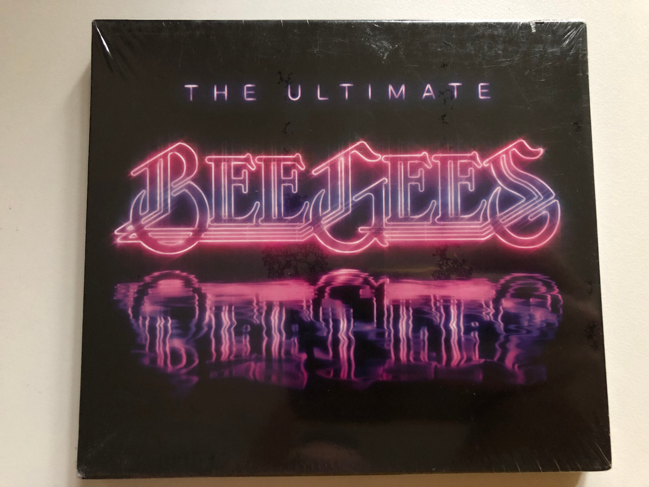 https://cdn11.bigcommerce.com/s-62bdpkt7pb/products/0/images/318185/The_Ultimate_Bee_Gees_Reprise_Records_2x_Audio_CD_2009_8122-79847-8_1__13054.1703663413.1280.1280.JPG?c=2
