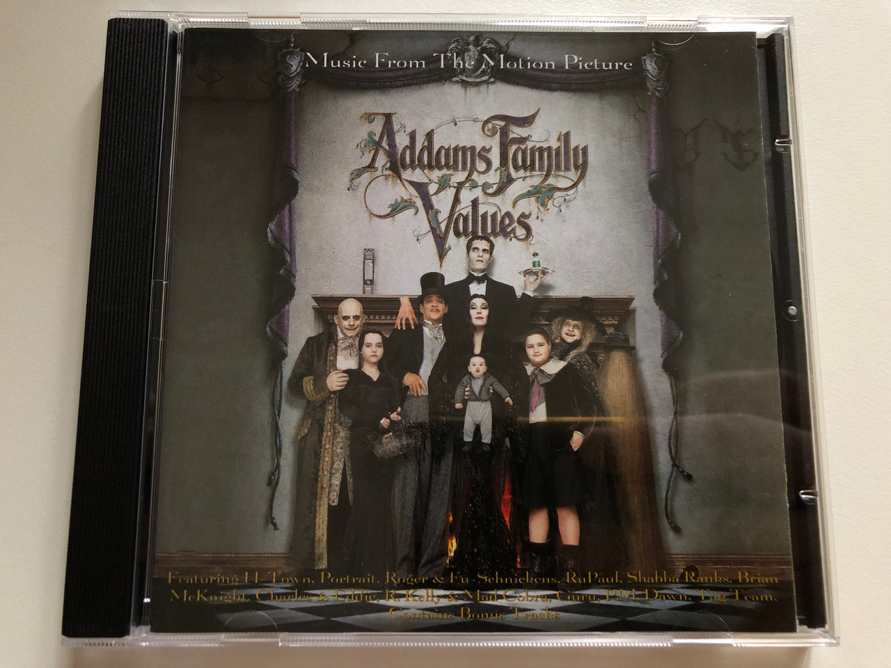 https://cdn11.bigcommerce.com/s-62bdpkt7pb/products/0/images/318199/Addams_Family_Values_Music_From_The_Motion_Picture_-_Featuring_H-Town_Portrait_Roger_Troutman_Fu-Schnickens_RuPaul_Shabba_Ranks_Brian_Mcknight_Charles_Eddie_R._Kelly_Mad_Cobra_1__67879.1703664785.1280.1280.JPG?c=2