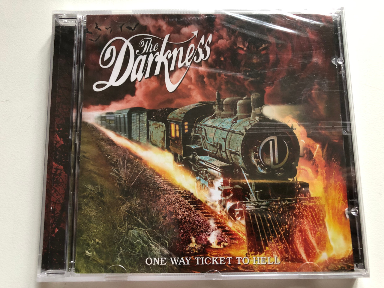 https://cdn11.bigcommerce.com/s-62bdpkt7pb/products/0/images/319133/The_Darkness_One_Way_Ticket_To_Hell..._And_Back_Atlantic_Audio_CD_2005_5051011121821_1__97561.1703832366.1280.1280.JPG?c=2