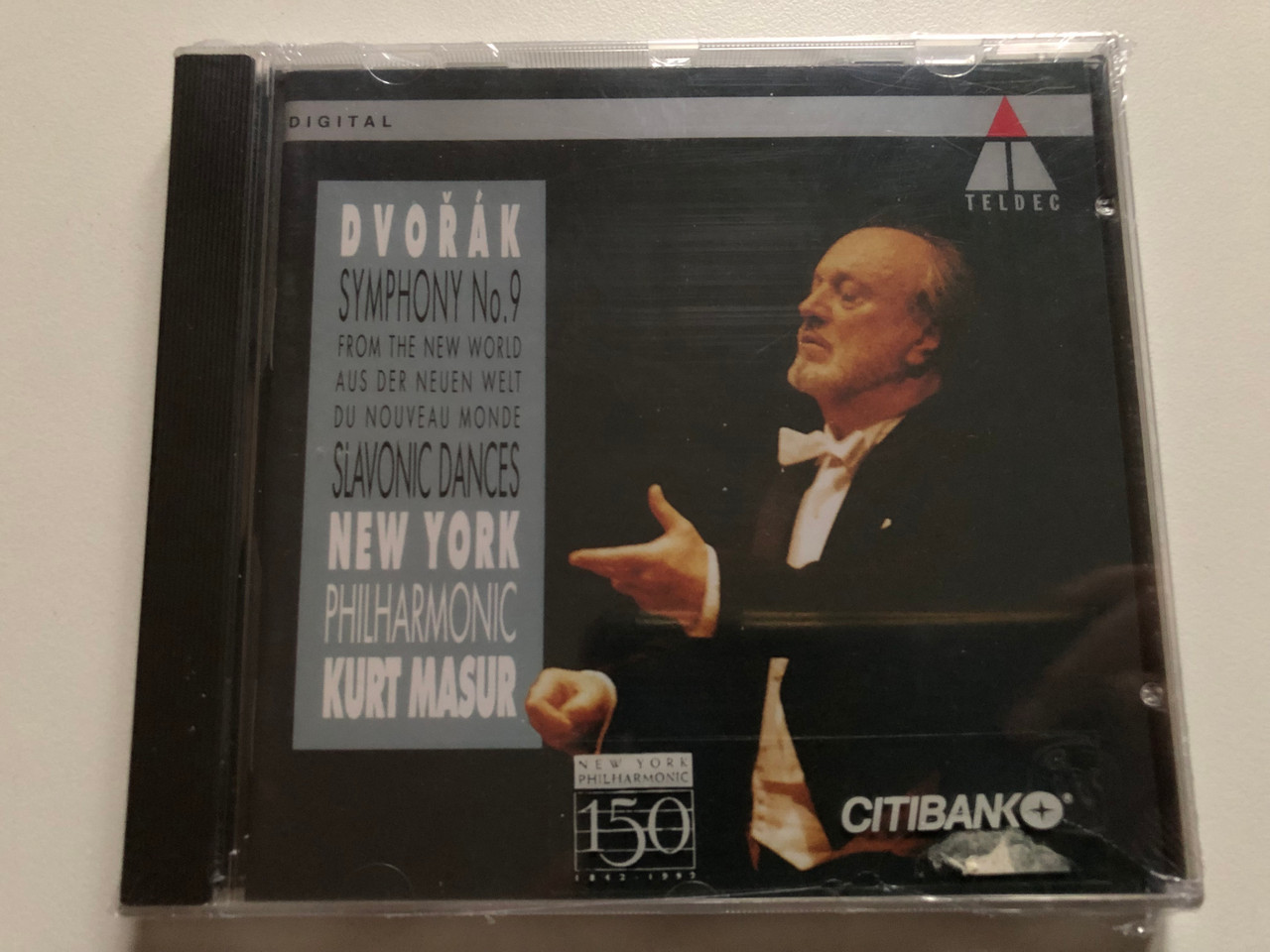 https://cdn11.bigcommerce.com/s-62bdpkt7pb/products/0/images/319433/Dvok_Symphony_No._9_From_The_New_World_-_Slavonic_Dances_New_York_Philharmonic_Kurt_Masur_Teldec_Audio_CD_1992_9031-73244-2_1__68099.1704106491.1280.1280.JPG?c=2