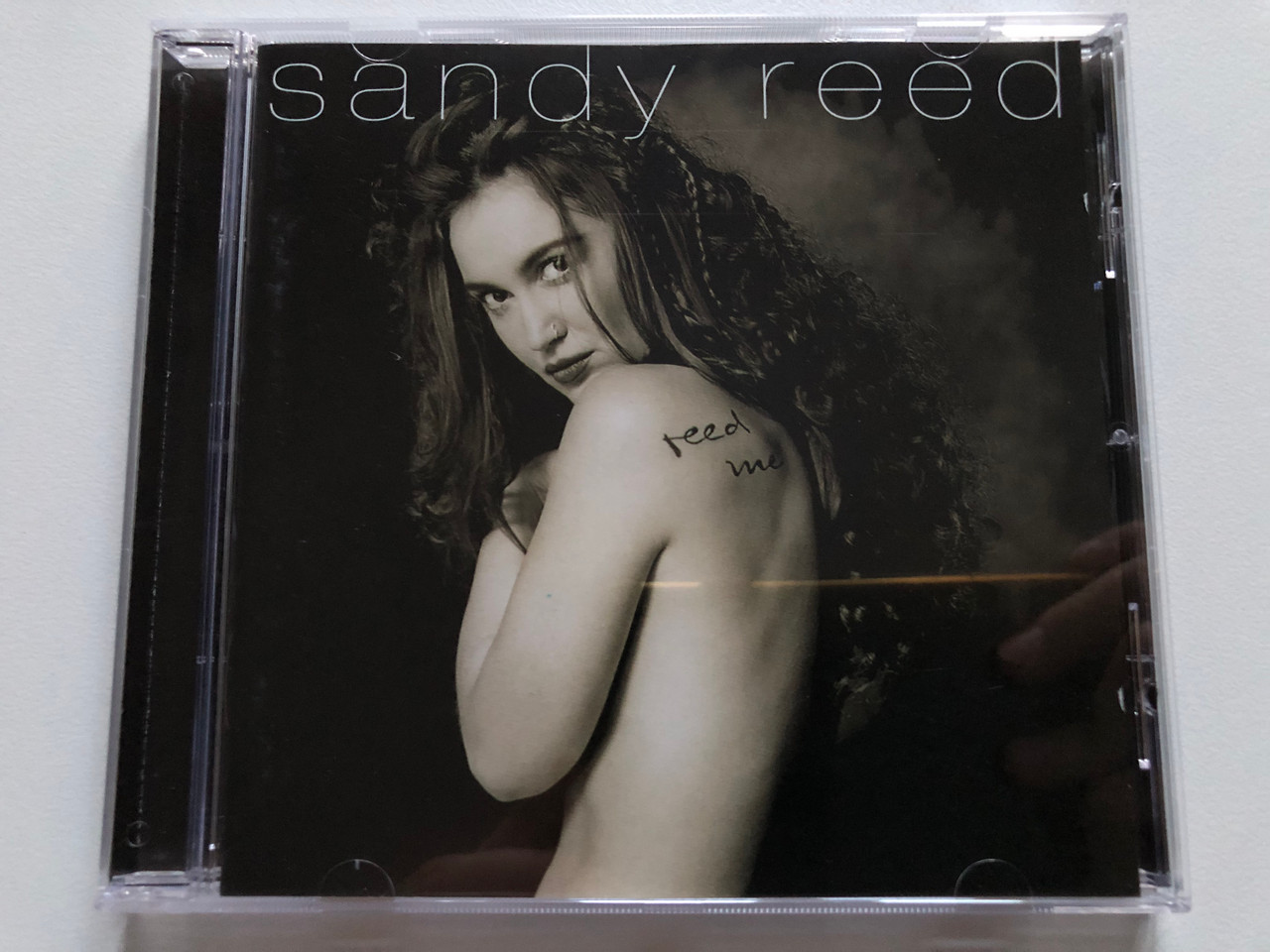 https://cdn11.bigcommerce.com/s-62bdpkt7pb/products/0/images/319755/Sandy_Reed_Reed_Me_WEA_Records_Audio_CD_1996_0630-14428-2_1__82104.1704237553.1280.1280.JPG?c=2