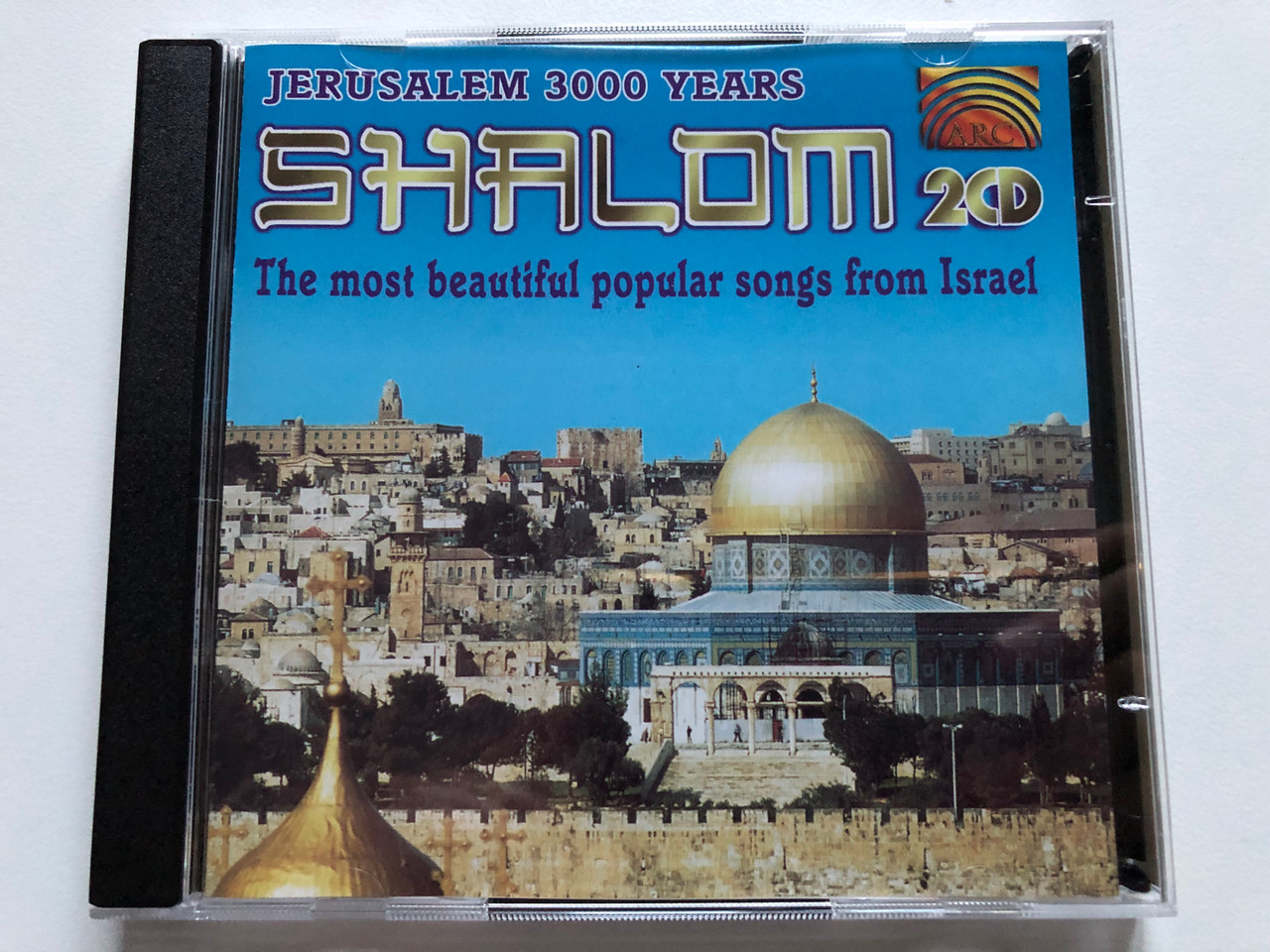 https://cdn11.bigcommerce.com/s-62bdpkt7pb/products/0/images/319768/Shalom_Jerusalem_3000_Years_-_The_Most_Beautiful_Popular_Songs_From_Israel_ARC_Music_2x_Audio_CD_1996_EUCD_0219_1__38770.1704273945.1280.1280.JPG?c=2