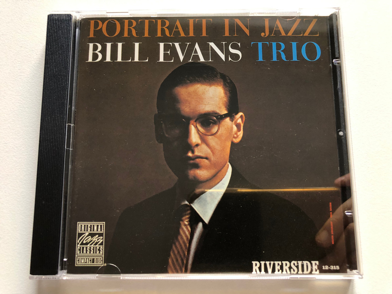 https://cdn11.bigcommerce.com/s-62bdpkt7pb/products/0/images/320631/Bill_Evans_Trio_Portrait_In_Jazz_Original_Jazz_Classics_Audio_CD_Stereo_OJCCD-088-2_1__05267.1704696731.1280.1280.JPG?c=2