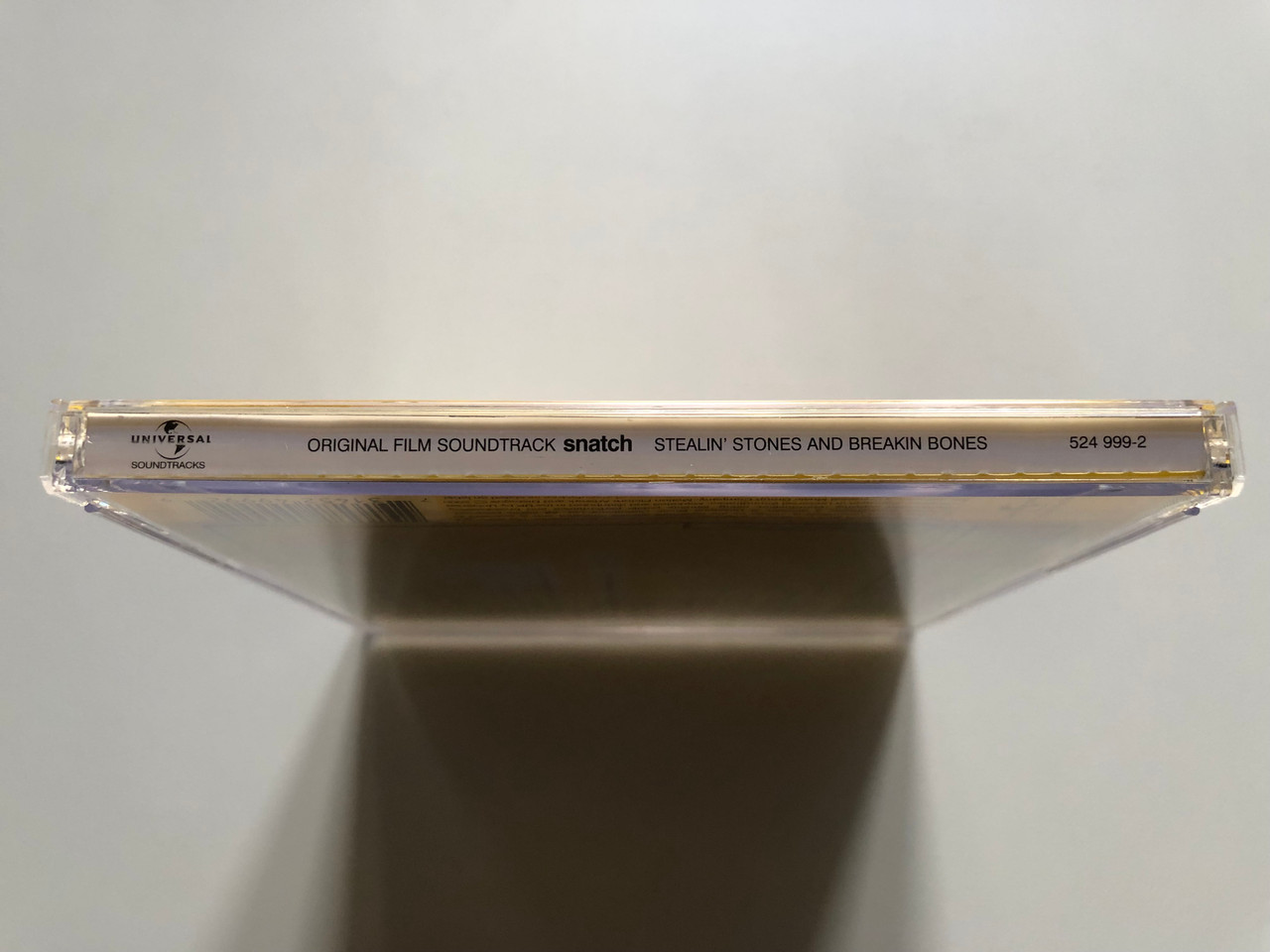 https://cdn11.bigcommerce.com/s-62bdpkt7pb/products/0/images/320990/Snatch_Stealin_Stones_And_Breakin_Bones_Original_Film_Soundtrack_Universal_Soundtracks_Audio_CD_2000_524_999-2_3__18704.1704863184.1280.1280.JPG?c=2
