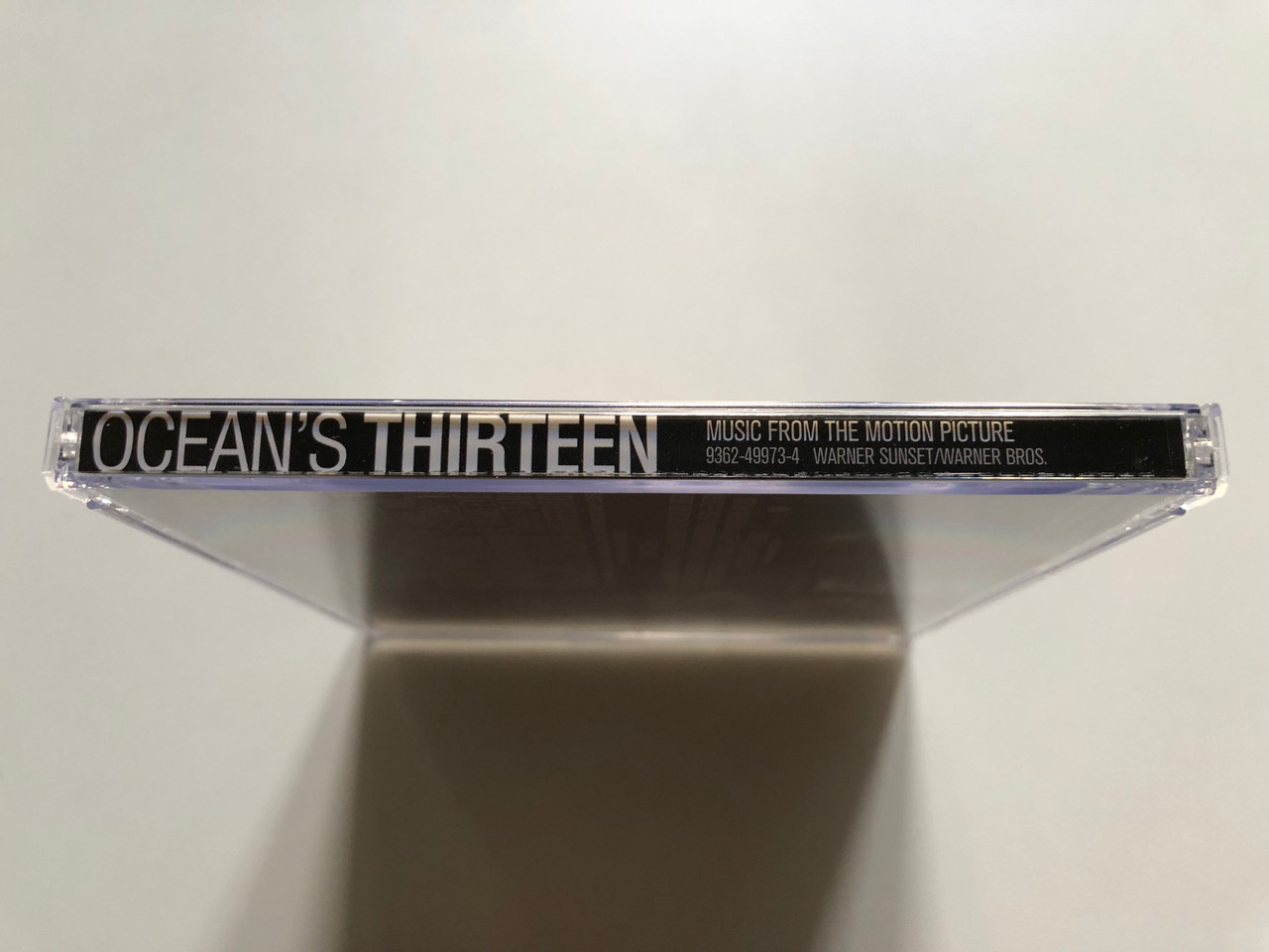https://cdn11.bigcommerce.com/s-62bdpkt7pb/products/0/images/320996/Music_From_The_Motion_Picture_Oceans_Thirteen_-_Music_By_David_Holmes_Warner_Sunset_Records_Audio_CD_2007_9362-49973-4_3__61728.1704864072.1280.1280.JPG?c=2