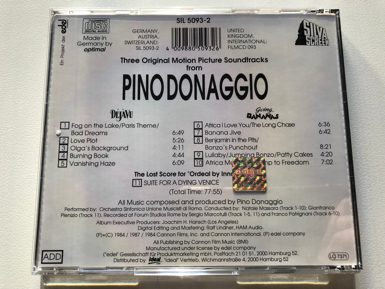 https://cdn11.bigcommerce.com/s-62bdpkt7pb/products/0/images/321272/Pino_Donaggio_Dj_Vu_Going_Bananas_Suite_for_a_Dying_Venice_The_Lost_Score_for_Ordeal_By_Innocence_Three_Original_Motion_Picture_Soundtracks_Silva_Screen_Audio_CD_1992_SIL_5093-__58588.1704950409.1280.1280.JPG?c=2