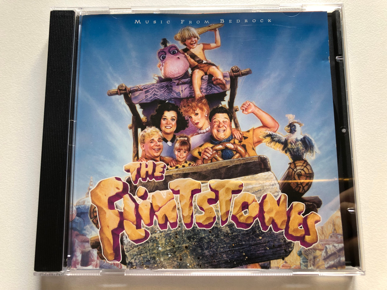 https://cdn11.bigcommerce.com/s-62bdpkt7pb/products/0/images/321307/The_Flintstones_OST_-_Music_From_Bedrock_MCA_Soundtracks_Audio_CD_1994_MCD_11045_1__19588.1704963544.1280.1280.JPG?c=2