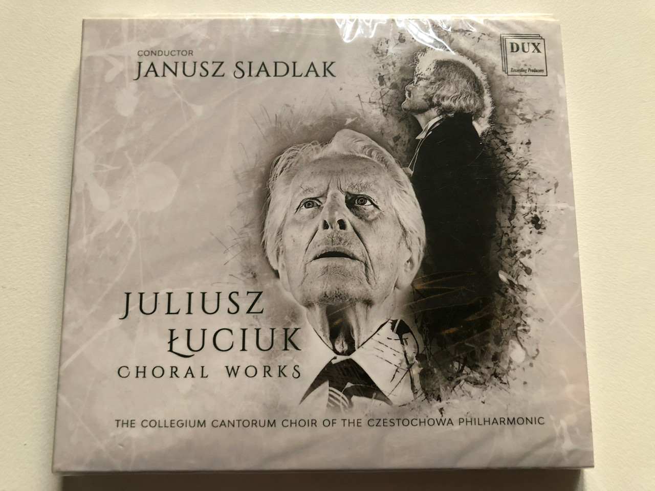 https://cdn11.bigcommerce.com/s-62bdpkt7pb/products/0/images/321357/Juliusz_uciuk_Choral_Works_-_Conductor_Janusz_Siadlak_The_Collegium_Cantorum_Choir_Of_The_Czestochowa_Philharmonic_DUX_Recording_Producers_Audio_CD_2018_DUX_1463_1__01317.1705070535.1280.1280.JPG?c=2