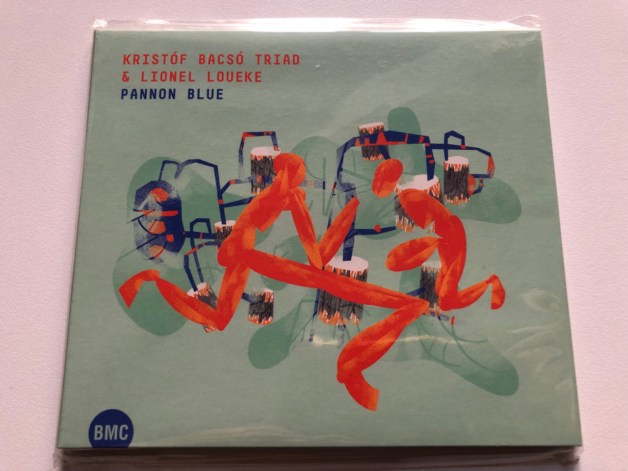 https://cdn11.bigcommerce.com/s-62bdpkt7pb/products/0/images/321369/Bacs_Kristf_Triad_Lionel_Loueke_Pannon_Blue_Budapest_Music_Center_Records_Audio_CD_2016_BMC_CD_232_1__64730.1705073429.1280.1280.JPG?c=2