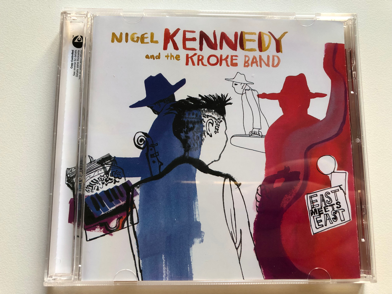 https://cdn11.bigcommerce.com/s-62bdpkt7pb/products/0/images/321445/Nigel_Kennedy_And_The_Kroke_Band_East_Meets_East_EMI_Audio_CD_2003_Stereo_724355751126_1__24949.1705075790.1280.1280.JPG?c=2