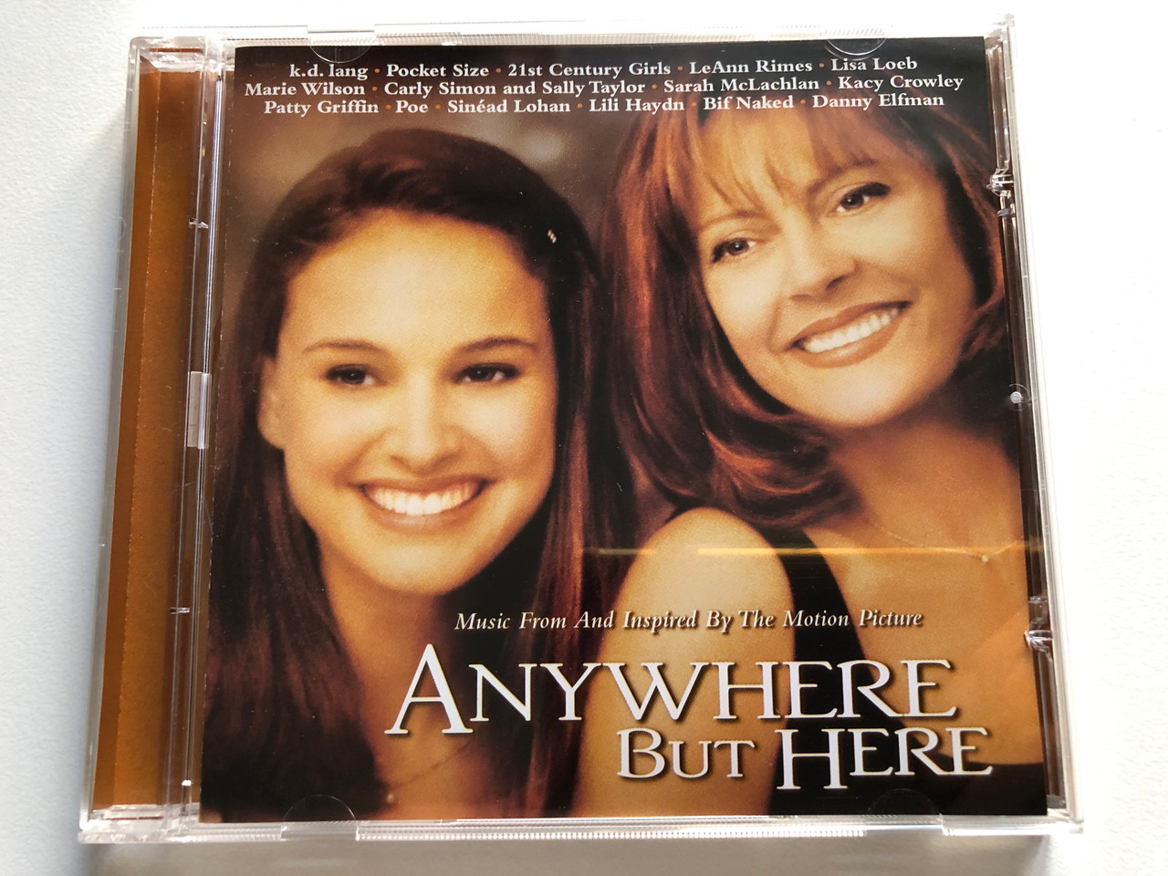 https://cdn11.bigcommerce.com/s-62bdpkt7pb/products/0/images/321730/Anywhere_But_Here_Music_From_And_Inspired_By_The_Motion_Picture_-_k._d._lang_Pocket_Size_21st_Century_Girls_LeAnn_Rimes_Lisa_Loeb_Marie_Wilson_Carly_Simon_And_Sally_Taylor_Sarah_McLac_1__36159.1705420314.1280.1280.JPG?c=2