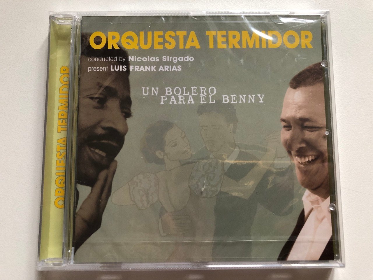 https://cdn11.bigcommerce.com/s-62bdpkt7pb/products/0/images/321860/Orquesta_Termidor_Un_Bolero_Para_El_Benny_-_Conducted_by_Nicolas_Sirgado_Present_Luis_Frank_Arias_Connector_Records_Audio_CD_2008_59851-2_1__41208.1705554631.1280.1280.JPG?c=2