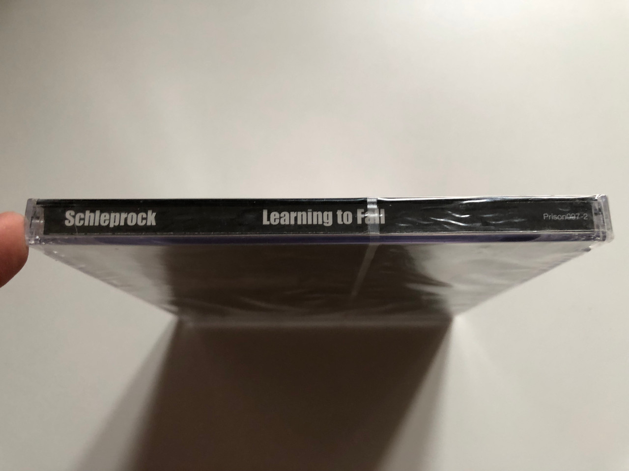 https://cdn11.bigcommerce.com/s-62bdpkt7pb/products/0/images/321871/Schleprock_Learning_To_Fall_I_Used_To_Fuck_People_Like_You_In_Prison_Records_Audio_CD_2005_Prison097-2_3__57530.1705555961.1280.1280.JPG?c=2