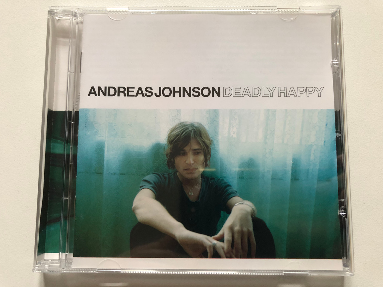 https://cdn11.bigcommerce.com/s-62bdpkt7pb/products/0/images/322160/Andreas_Johnson_Deadly_Happy_WEA_Audio_CD_2002_0927-43084-2_1__78582.1705996235.1280.1280.JPG?c=2