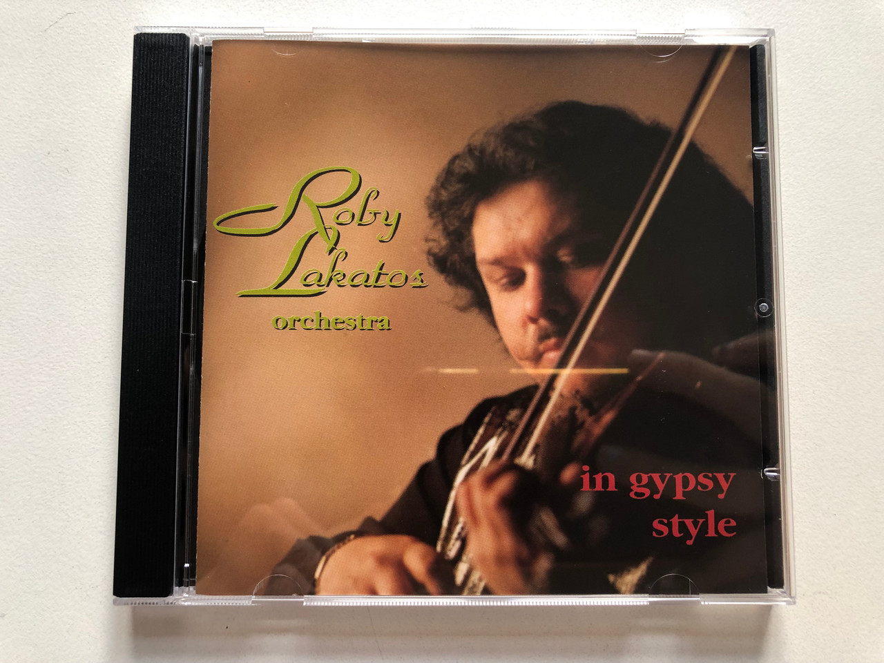 https://cdn11.bigcommerce.com/s-62bdpkt7pb/products/0/images/322301/Roby_Lakatos_Orchestra_In_Gipsy_Style_MW_Records_Audio_CD_1995_MWCD_4010_1__21328.1706085899.1280.1280.JPG?c=2