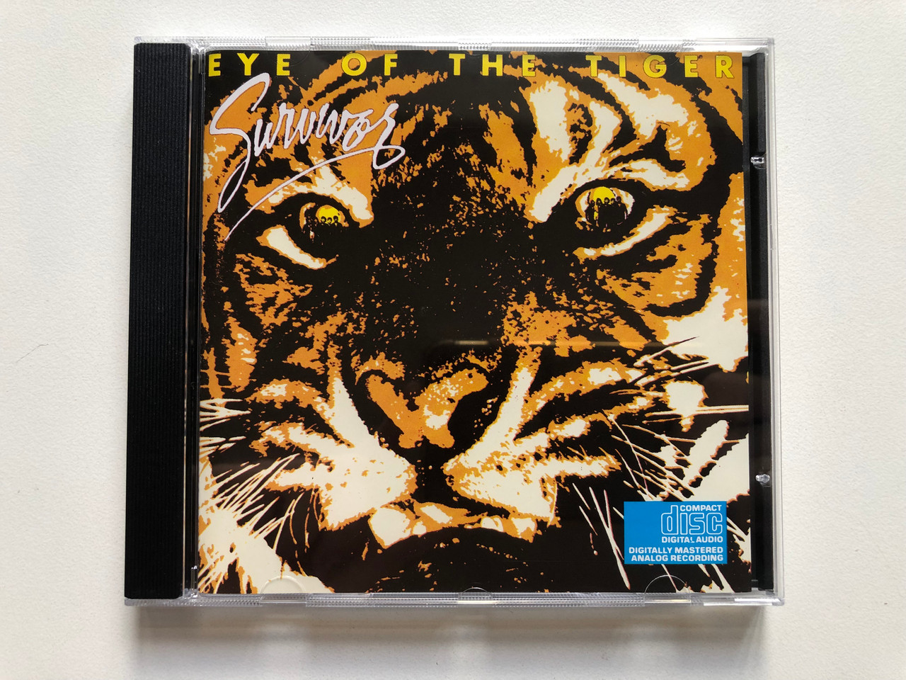 https://cdn11.bigcommerce.com/s-62bdpkt7pb/products/0/images/322387/Survivor_Eye_Of_The_Tiger_Scotti_Bros._Records_Audio_CD_1990_512_025-2_1__49447.1706173066.1280.1280.JPG?c=2