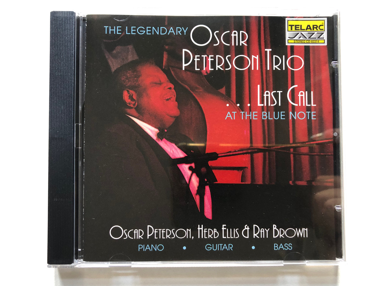 https://cdn11.bigcommerce.com/s-62bdpkt7pb/products/0/images/322418/The_Legendary_Oscar_Peterson_Trio_Last_Call_At_The_Blue_Note_Oscar_Peterson_piano_Herb_Ellis_guitar_Ray_Brown_bass_Telarc_Jazz_Audio_CD_1992_CD-83314_1__46289.1706179073.1280.1280.JPG?c=2