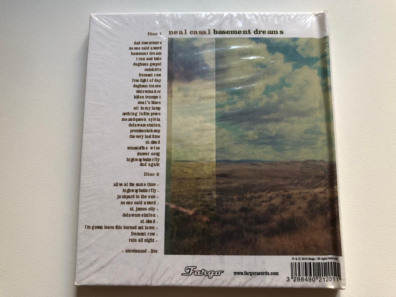 https://cdn11.bigcommerce.com/s-62bdpkt7pb/products/0/images/322896/Neal_Casal_Basement_Dreams_Fargo_Records_2x_Audio_CD_2010_FR21201_2__49310.1706695430.1280.1280.JPG?c=2