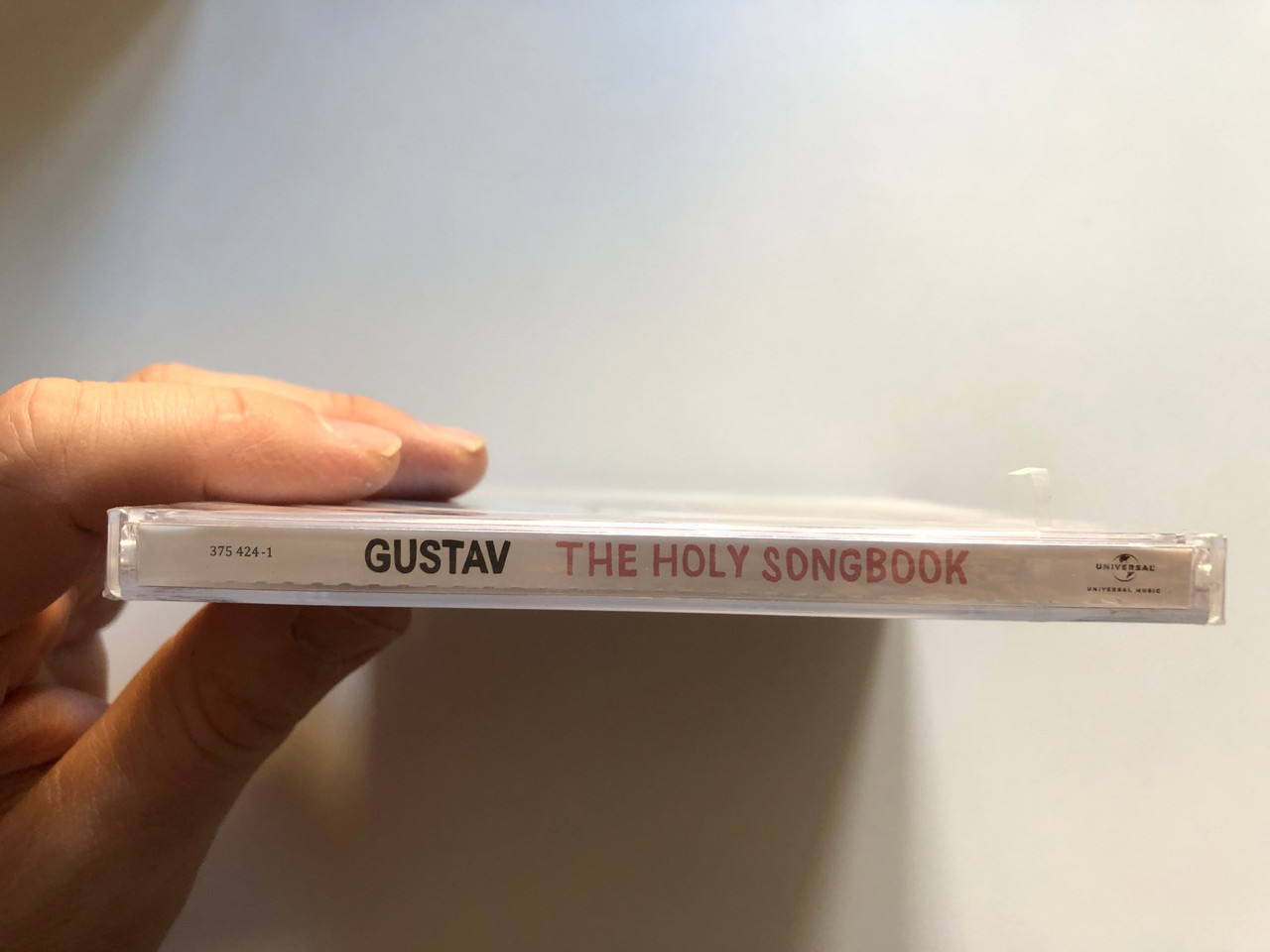 https://cdn11.bigcommerce.com/s-62bdpkt7pb/products/0/images/322901/Gustav_The_Holy_Songbook_Universal_Music_Audio_CD_2013_375_424-1_3__28937.1706697504.1280.1280.JPG?c=2