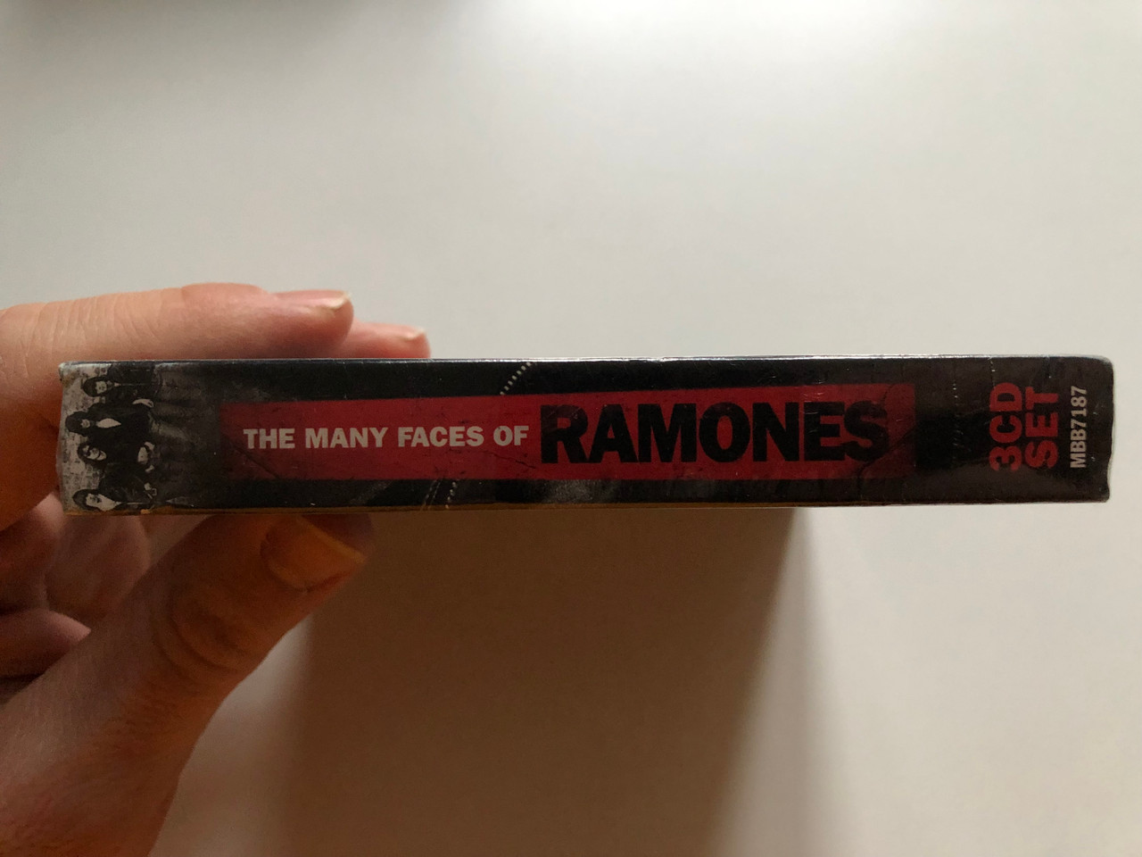 https://cdn11.bigcommerce.com/s-62bdpkt7pb/products/0/images/323119/The_Many_Faces_Of_Ramones_-_A_Journey_Through_The_Inner_World_Of_Ramones_Music_Brokers_3x_Audio_CD_2014_MBB7187_3__29472.1706781678.1280.1280.JPG?c=2