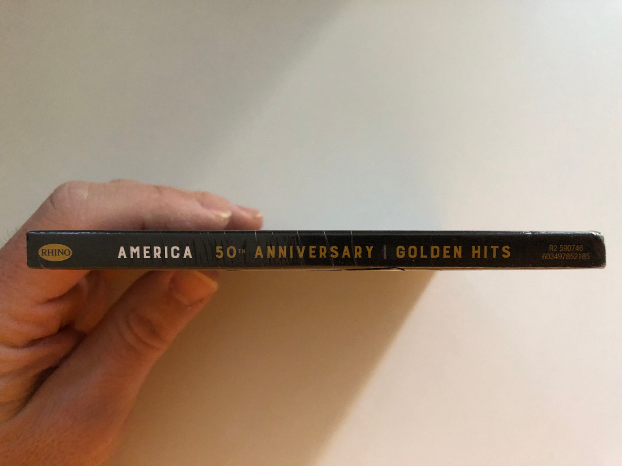 https://cdn11.bigcommerce.com/s-62bdpkt7pb/products/0/images/323575/America_50th_Anniversary_-_Golden_Hits_Celebrating_50_Years_Of_Golden_Hits_Includes_A_Horse_With_No_Name_I_Need_You_Ventura_Highway_Lonely_People_Tin_Man_Sister_Golden_Hair_You_Can_3__96357.1707129443.1280.1280.JPG?c=2