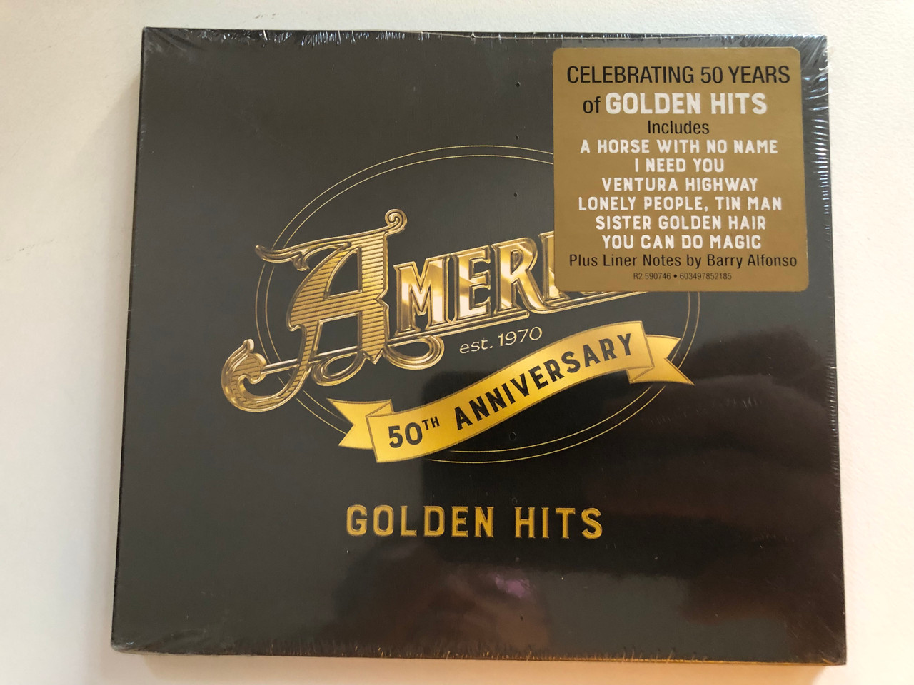 https://cdn11.bigcommerce.com/s-62bdpkt7pb/products/0/images/323577/America_50th_Anniversary_-_Golden_Hits_Celebrating_50_Years_Of_Golden_Hits_Includes_A_Horse_With_No_Name_I_Need_You_Ventura_Highway_Lonely_People_Tin_Man_Sister_Golden_Hair_You_Can_Do_1__32991.1707129460.1280.1280.JPG?c=2