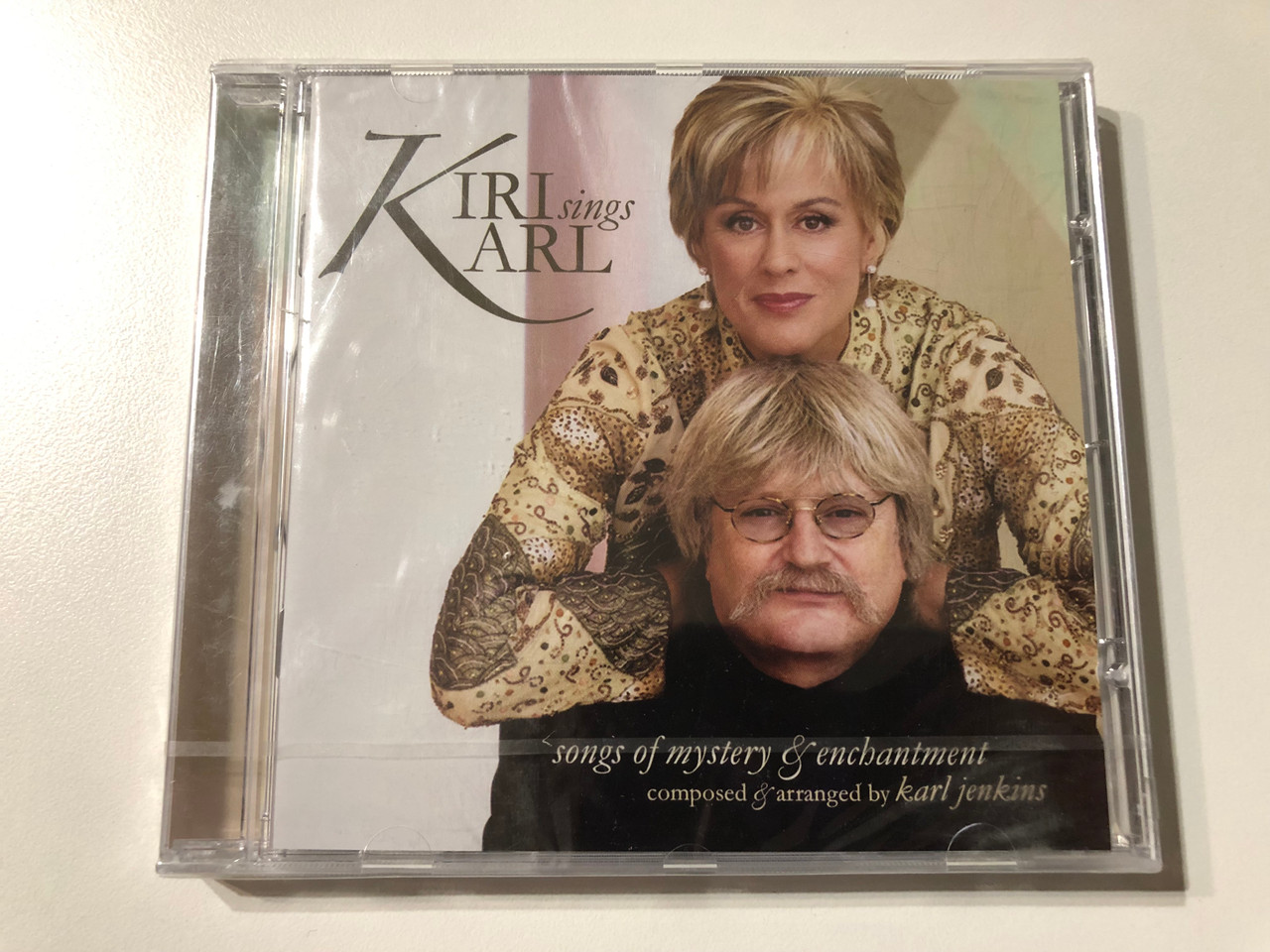 https://cdn11.bigcommerce.com/s-62bdpkt7pb/products/0/images/323821/Kiri_Sings_Karl_Songs_Of_Mystery_Enchantment_-_Composed_arranged_by_Karl_Jenkins_EMI_Classics_Audio_CD_2006_Stereo_094635325720_1__86847.1707377477.1280.1280.JPG?c=2
