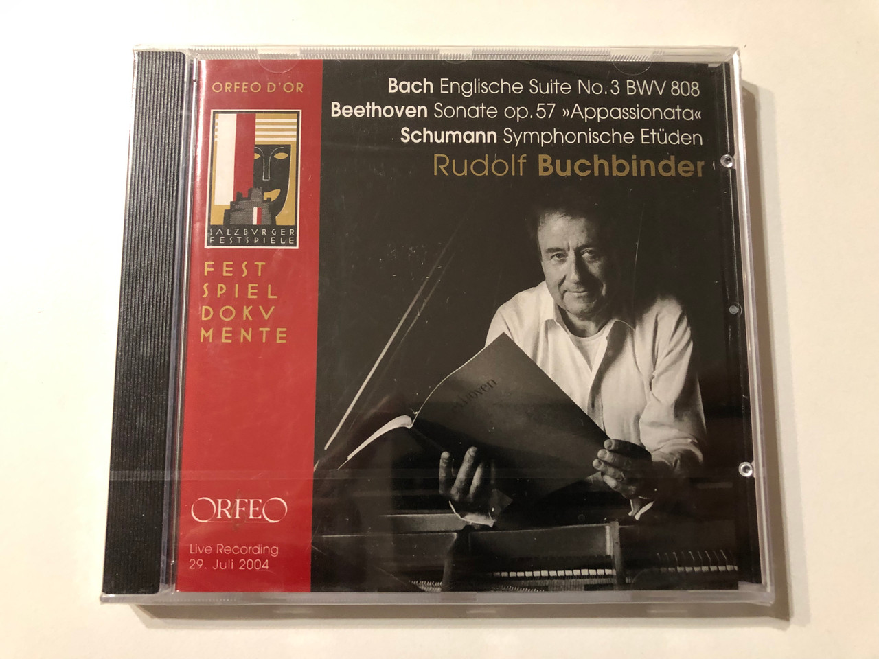 https://cdn11.bigcommerce.com/s-62bdpkt7pb/products/0/images/324170/Bach_Englische_Suite_No._3_BWV_808_Beethoven_Sonate_Op._57_Appassionata_Schumann_Symphonische_Etden_-_Rudolf_Buchbinder_Orfeo_Audio_CD_2008_C_775_081_B_1__26730.1707736195.1280.1280.JPG?c=2