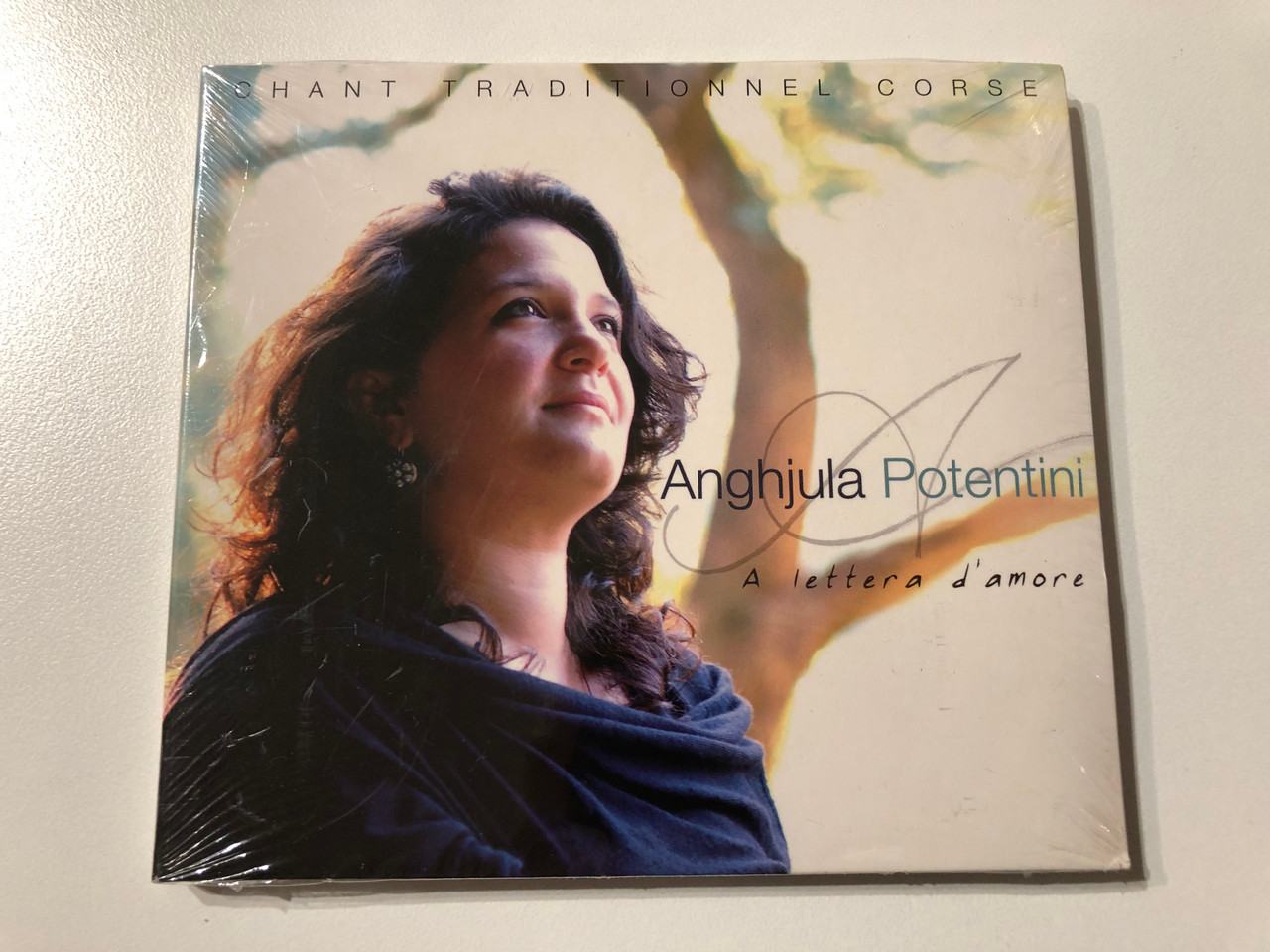https://cdn11.bigcommerce.com/s-62bdpkt7pb/products/0/images/325851/Anghjula_Potentini_A_Lettera_DAmore_-_Chant_Traditionnel_Corse_Buda_Musique_Audio_CD_2006_860130_1__81992.1709117529.1280.1280.JPG?c=2