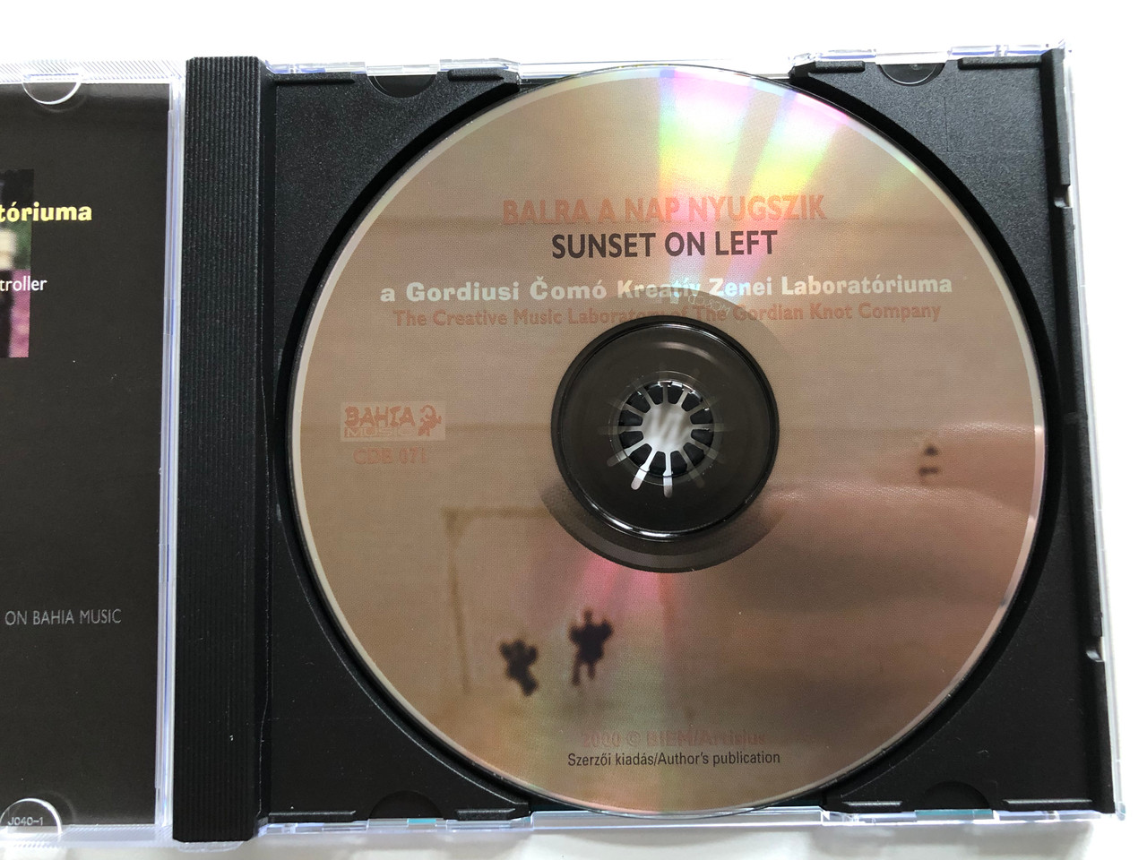 https://cdn11.bigcommerce.com/s-62bdpkt7pb/products/0/images/326455/Balra_A_Nap_Nyugszik_filmzene_Sunset_On_Left_soundtrack_-_The_Creative_Music_Laboratory_of_The_Gordian_Knot_Company_Szemzo_Tibor_Mihaly_Huszar_Magyar_C._Peter_T._Bali_Bahia_Music_3__66944.1709544622.1280.1280.JPG?c=2