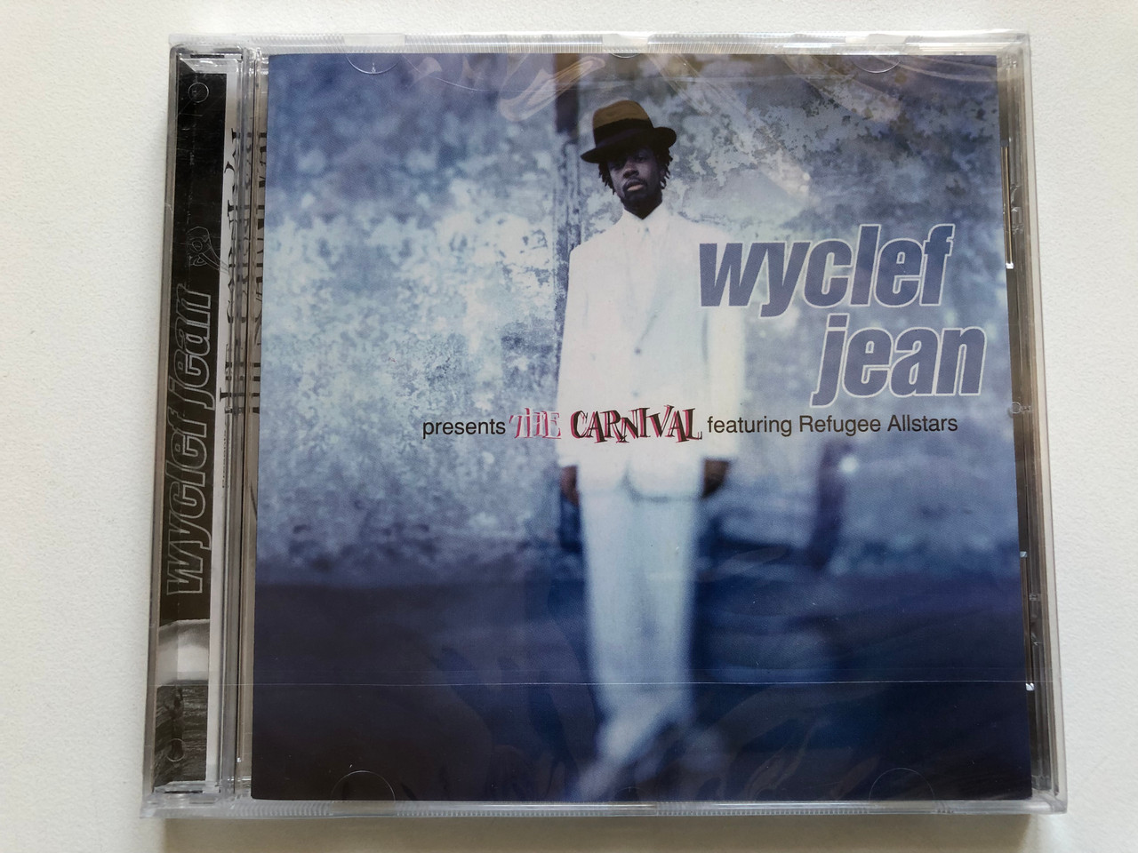 https://cdn11.bigcommerce.com/s-62bdpkt7pb/products/0/images/326549/Wyclef_Jean_Presents_The_Carnival_-_Featuring_Refugee_Allstars_Ruffhouse_Records_Audio_CD_1997_487442_2_1__74034.1709621689.1280.1280.JPG?c=2