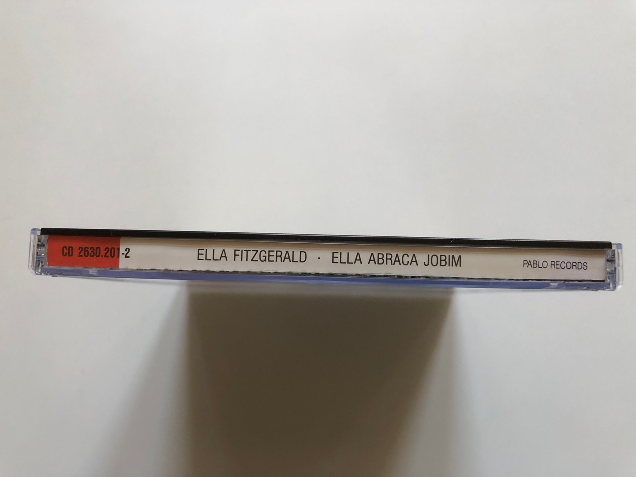 https://cdn11.bigcommerce.com/s-62bdpkt7pb/products/0/images/326588/Ella_Abraa_Jobim_-_Ella_Fitzgerald_Sings_The_Antonio_Carlos_Jobim_Song_Book_Pablo_Records_Audio_CD_Stereo_CD_2630_3__67039.1709631717.1280.1280.JPG?c=2