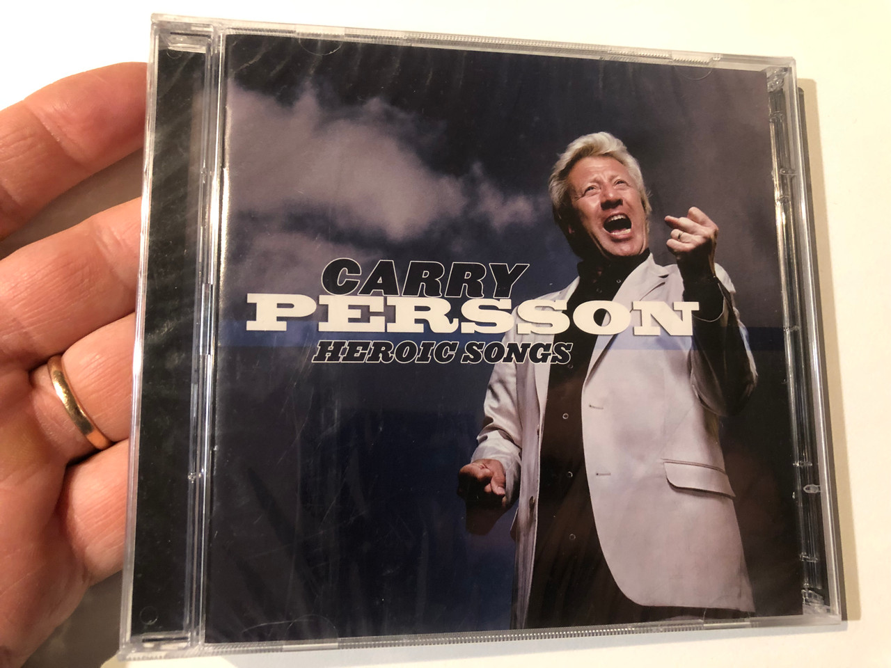 https://cdn11.bigcommerce.com/s-62bdpkt7pb/products/0/images/326934/Carry_Persson_Heroic_Songs_Sony_BMG_Music_Entertainment_Audio_CD_DVD_Video_2008_88697297712_1__20739.1710247256.1280.1280.JPG?c=2