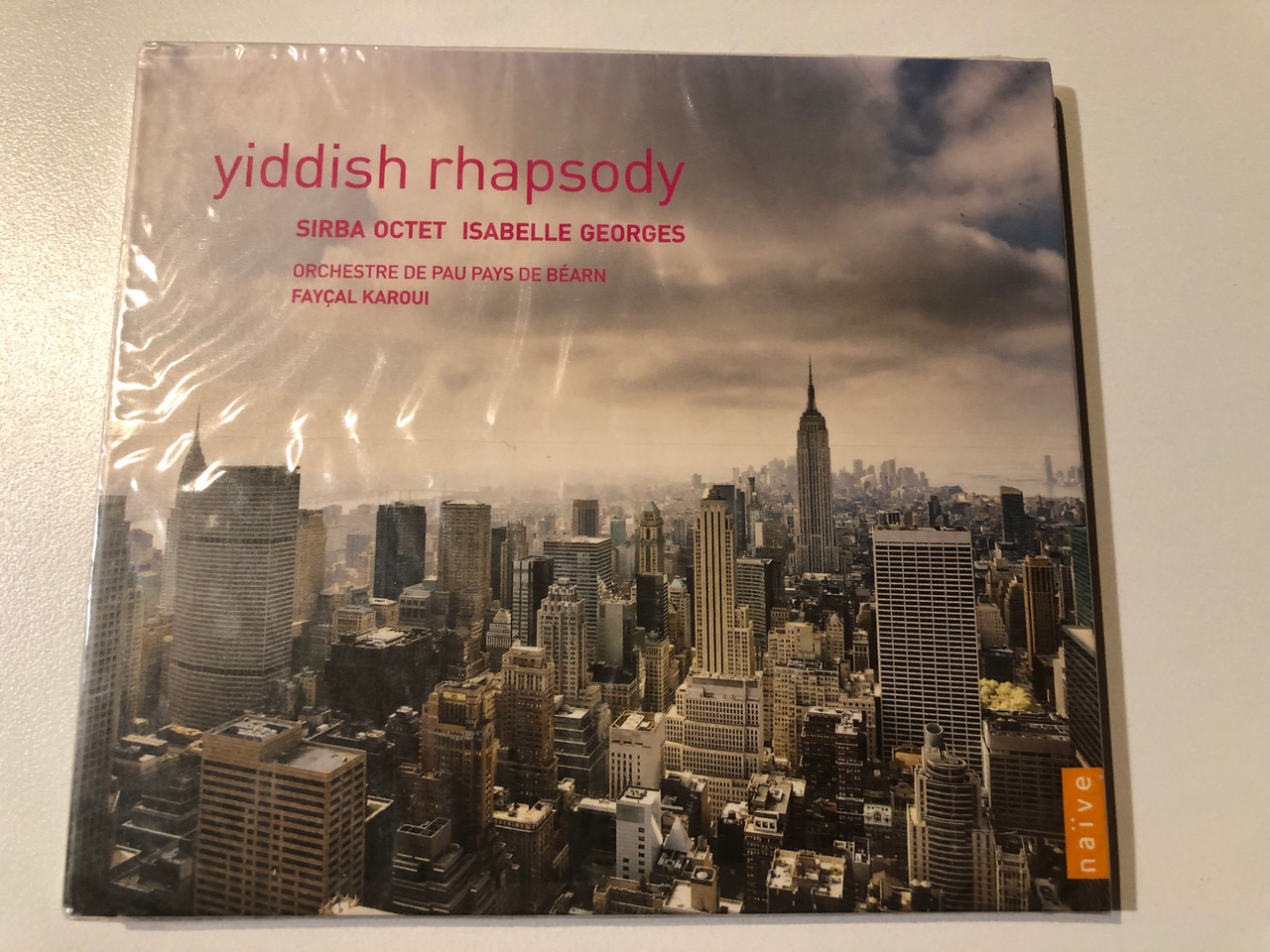 https://cdn11.bigcommerce.com/s-62bdpkt7pb/products/0/images/326979/Yiddish_Rhapsody_-_Sirba_Octet_Isabelle_Georges_Orchestre_De_Pau_Pays_De_Barn_Fayal_Karoui_Ambroisie_Audio_CD_2009_AM_191_1__84972.1710265296.1280.1280.JPG?c=2